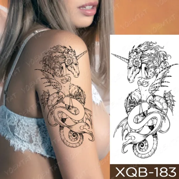 Intricate unicorn and serpent temporary tattoo on a model's shoulder.