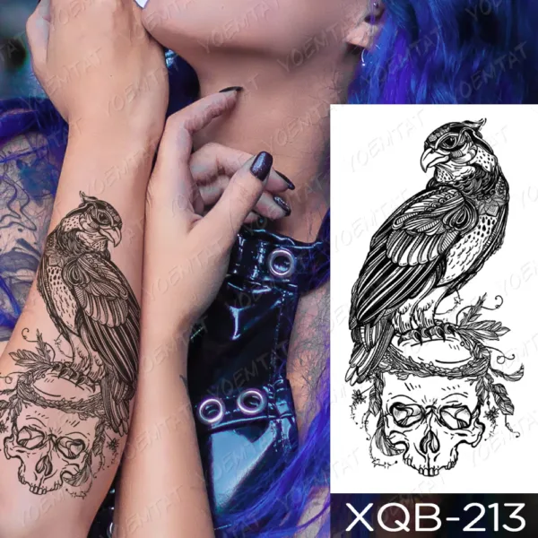 Intricate bird on skull temporary tattoo in black ink on forearm
