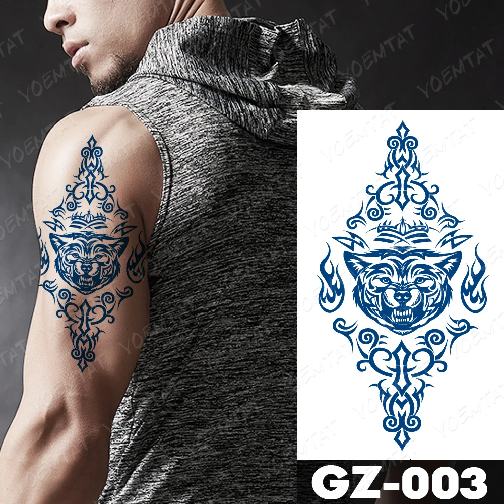 Stunning blue and black tribal wolf temporary tattoo on the arm