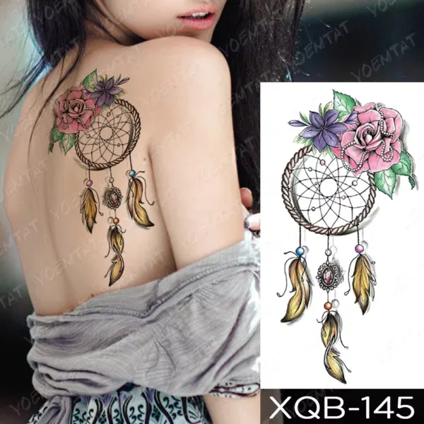 Ethereal dream catcher back tattoo with colorful feathers and flowers.